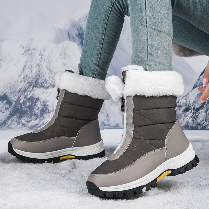 Gray quilted winter boots with front zippers and pale plush collars