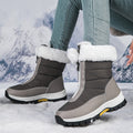 Gray quilted winter boots with front zippers and pale plush collars
