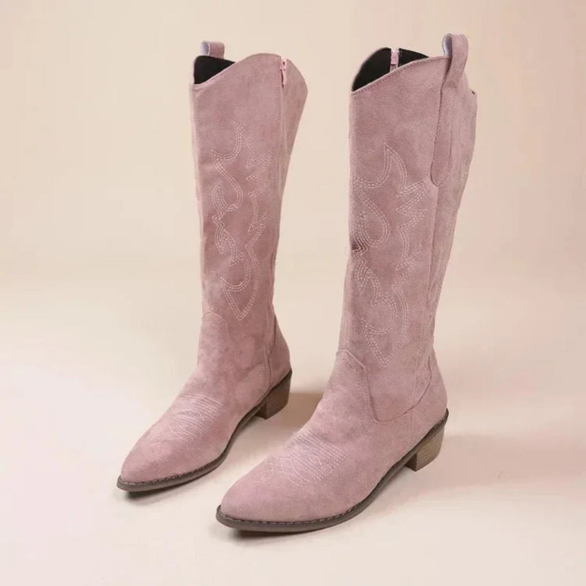 Women's Pointed Embroidered Western Boots in pink.