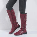 Women's Riding-Detail Adjustable Ankle Boots in burgundy.